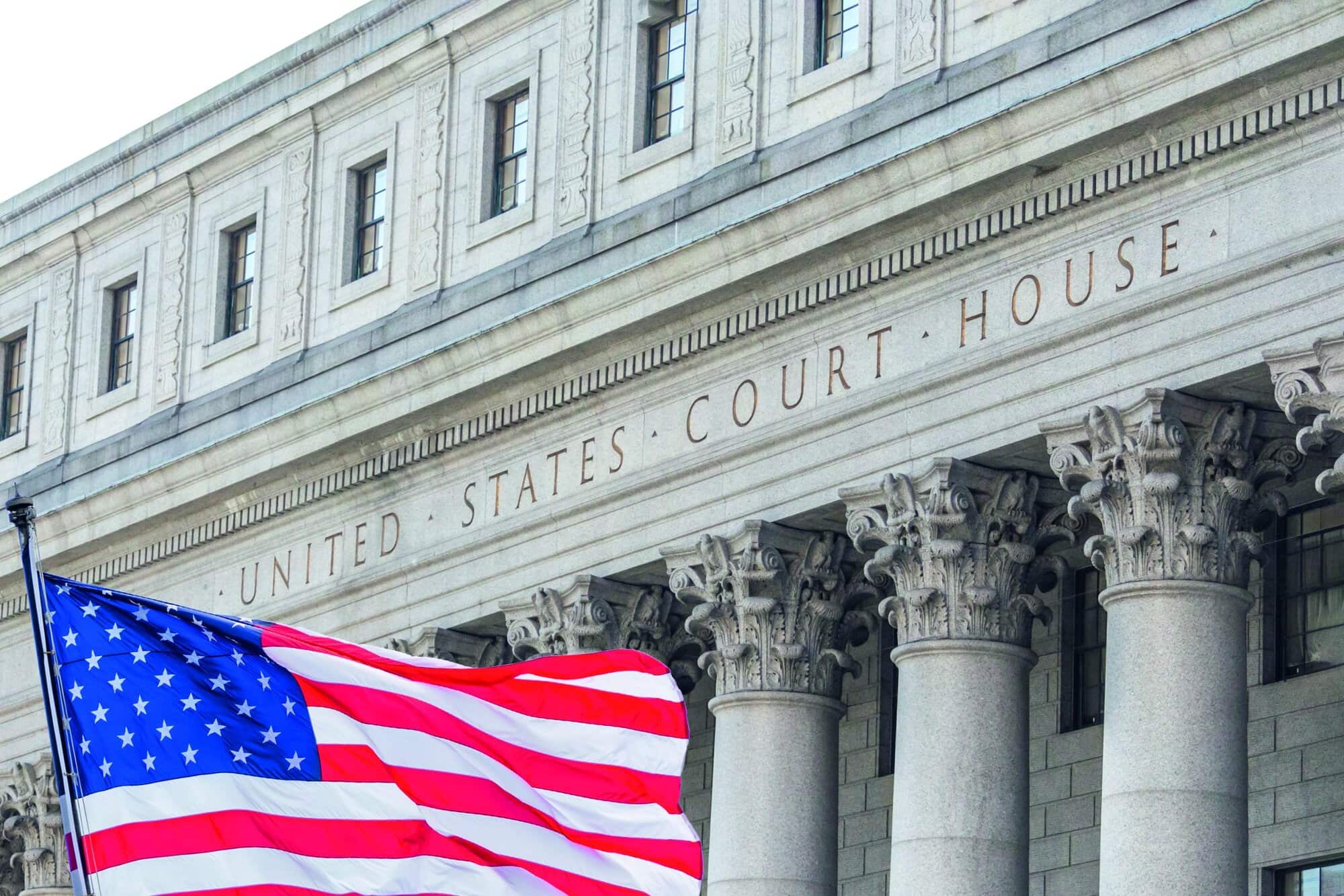 USA national flag waving in the wind in front of United States Court House in New York, USA