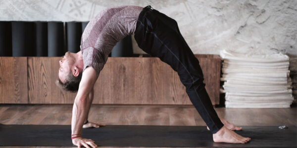 Davin Jones - man on the mat - full wheel pose