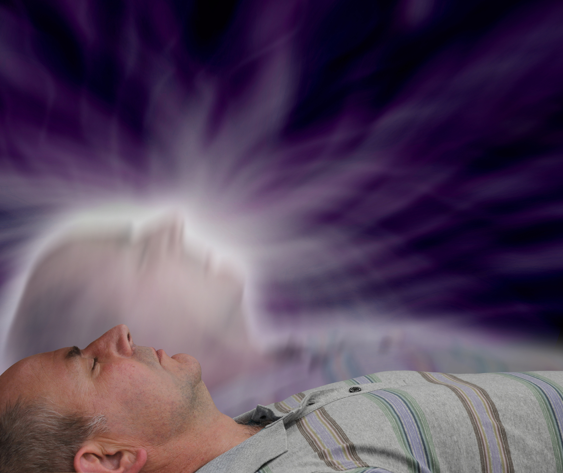 Male supine with eyes closed and soul astral projection  effect on dark background