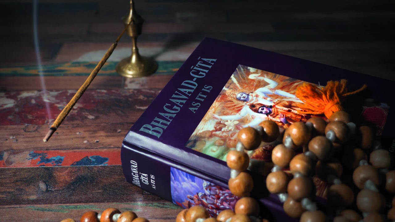 Bhagavad,Gita,And,Rosary,Lying,On,A,Wooden,Table,And What holds you back?