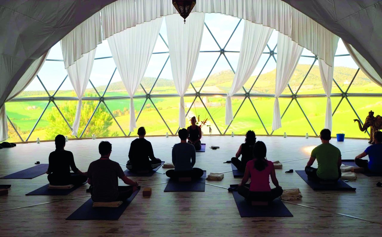Daily yoga in the Om Dome with views over the Andalusian countryside