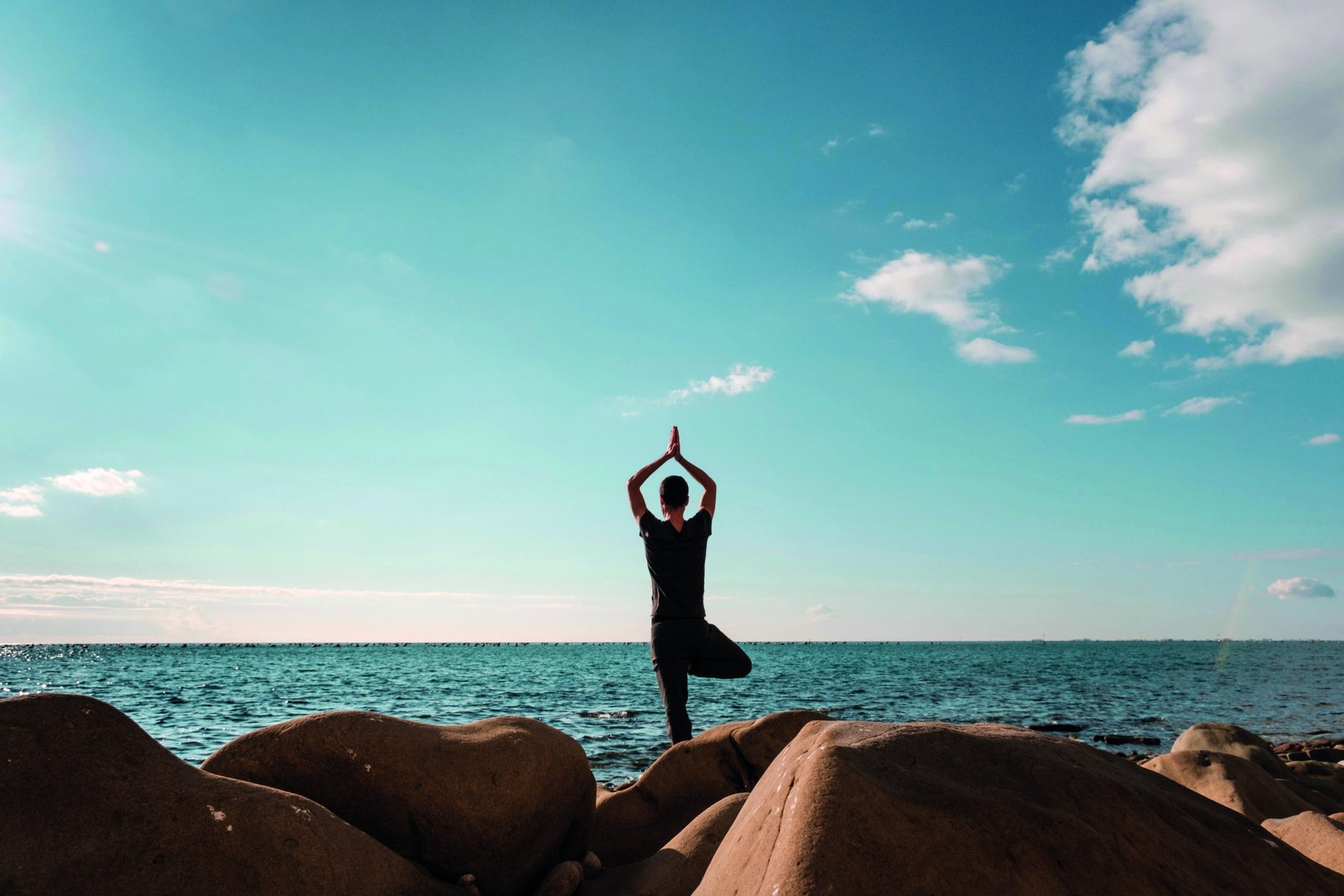 Attractive,Young,Man,Practicing,Yoga,Meditation,And,Breathwork,Outdoors,By Attractive young man practicing yoga meditation and breathwork outdoors by the sea