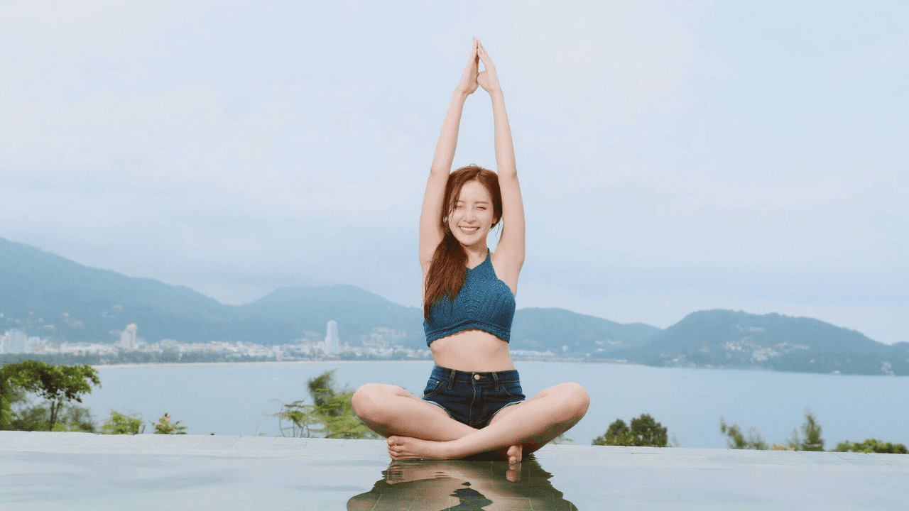 Trauma-informed Reasons and Methods for Avoiding Toxic Gratitude in Yoga Woman Doing Yoga on Poolside