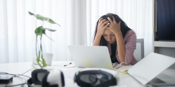 Photo of a Stressed Woman at Work