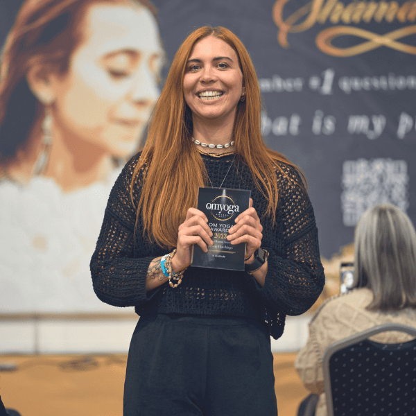 Chessie Hutchings holding her award