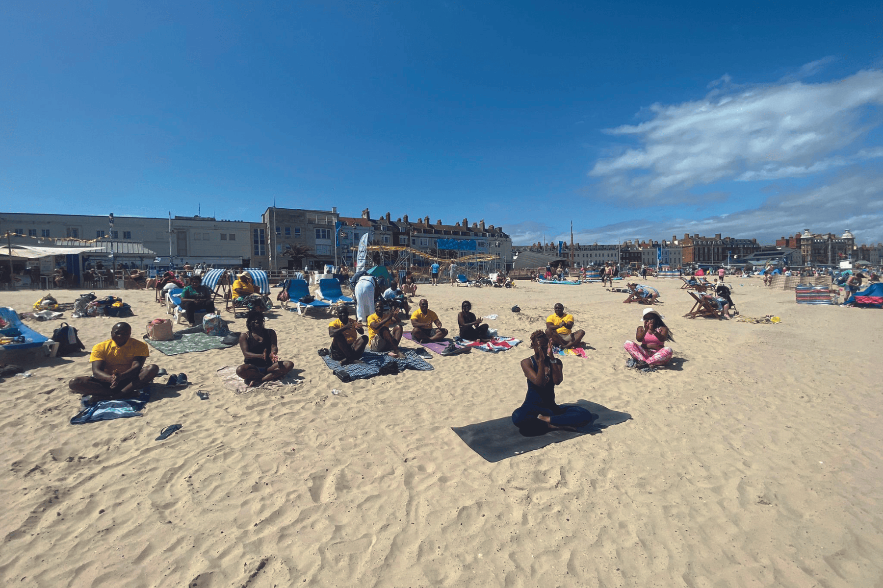 Yoga session by Jackie Ngu at Weymouth beach