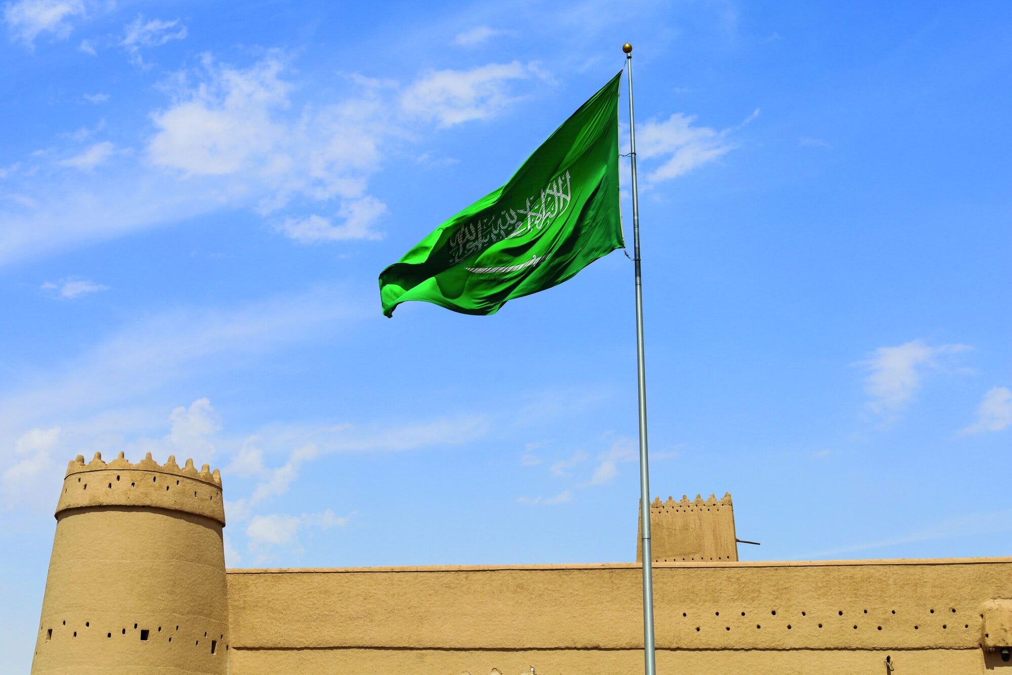Riyadh, Saudi Arabia, April 13 2024. a waving Saudi flag on Al Masmak Palace - National Day Saudi founding day