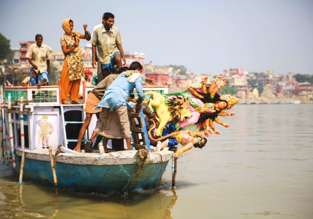 They make an offering into the Ganges. They make an offering into the Ganges.