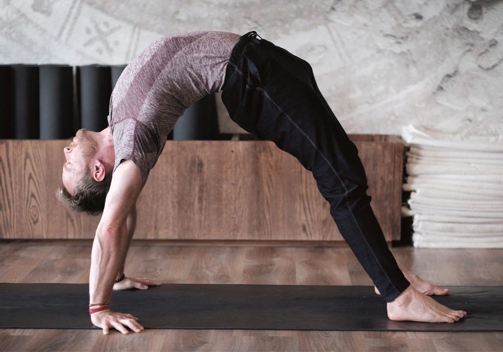 Davin Jones - man on the mat - full wheel pose