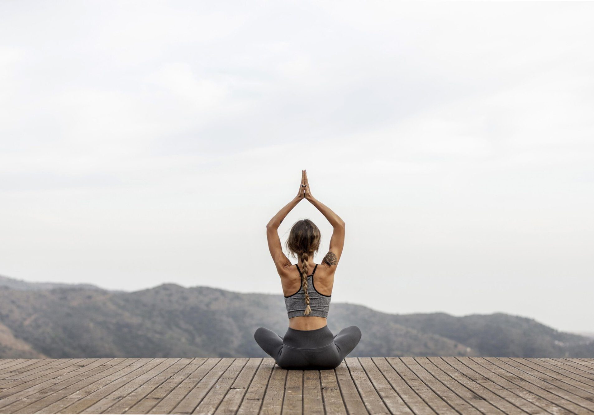 back-view-woman-doing-yoga-outdoors