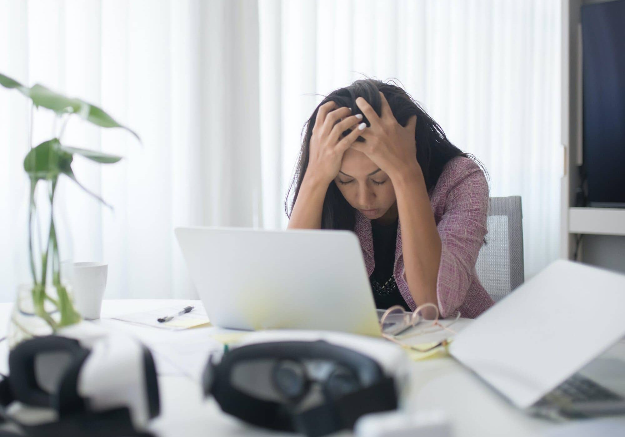 Photo of a Stressed Woman at Work